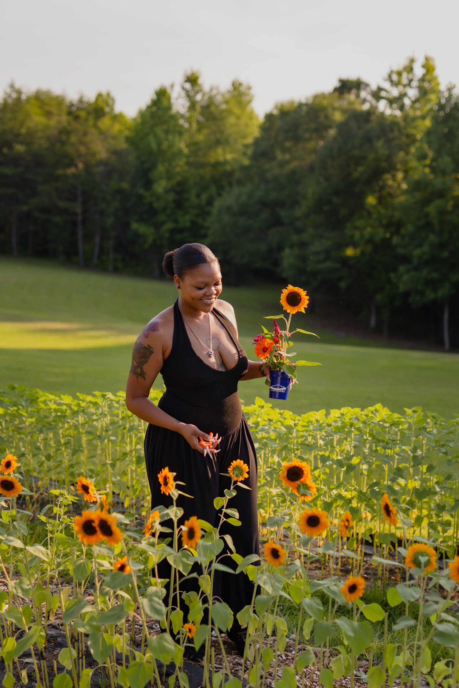 A guest standing in the sunflower field at Rabbit Crest Farms