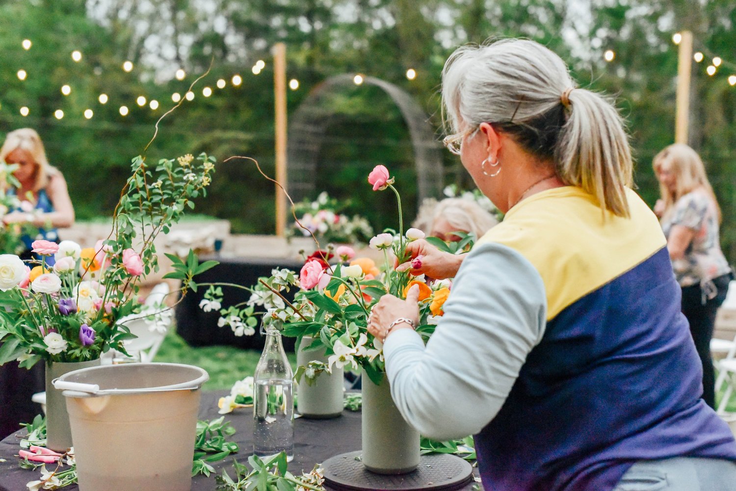 A private U-Pick group in the field holding their bouquets
